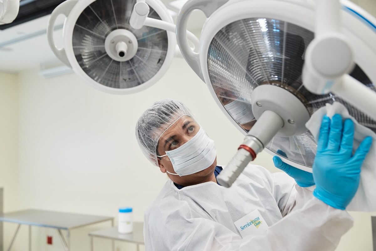 person with csct training cleaning operating room
